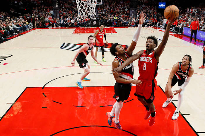 Rockets small forward Jae'Sean Tate (8) shoots the ball against Portland Trail Blazers point guard Brandon Williams (8) during the first half at Moda Center.